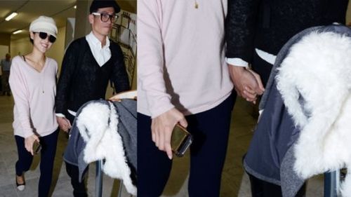 陈豪夫妇婚后首次现身 陈茵薇穿宽松衫遮肚